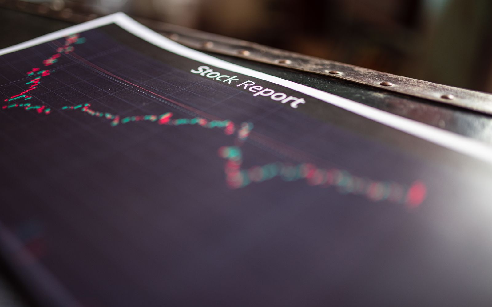 Detailed stock report showing market trends on paper charts.